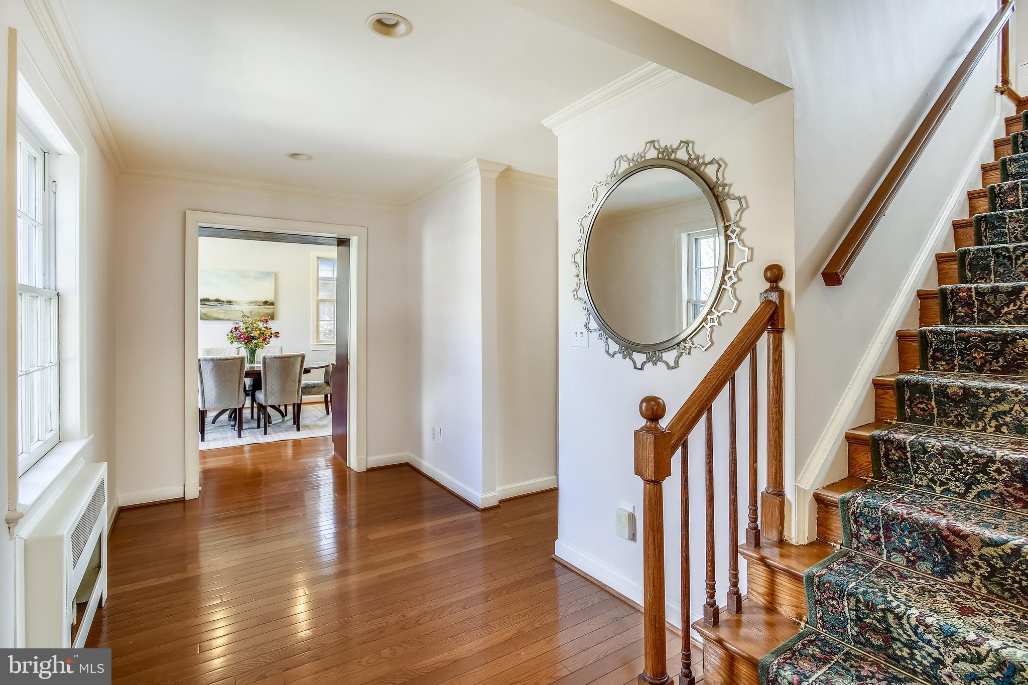 4664 Reservoir Road Northwest Washington, DC 20007 - Photo 5 of 60 a hallway with wooden floor windows and entryway