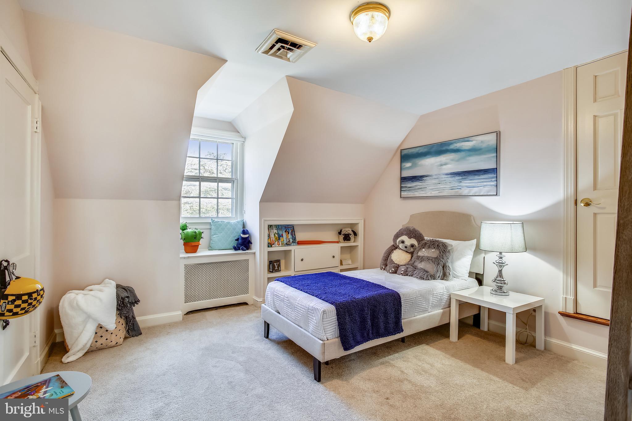 4664 Reservoir Road Northwest Washington, DC 20007 - Photo 41 of 60 a bedroom with a bed and a window