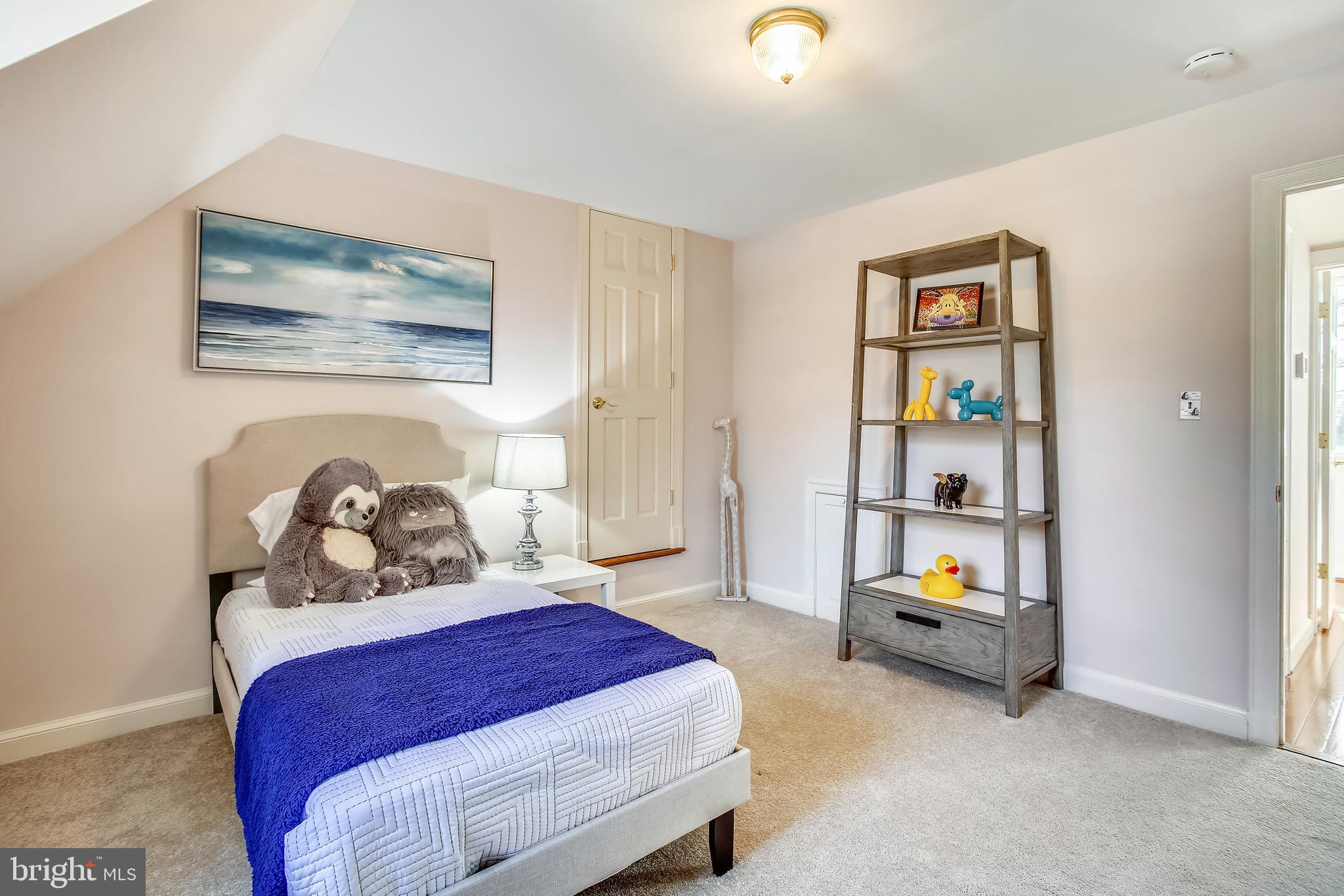 4664 Reservoir Road Northwest Washington, DC 20007 - Photo 42 of 60 a bedroom with bed and a book shelf