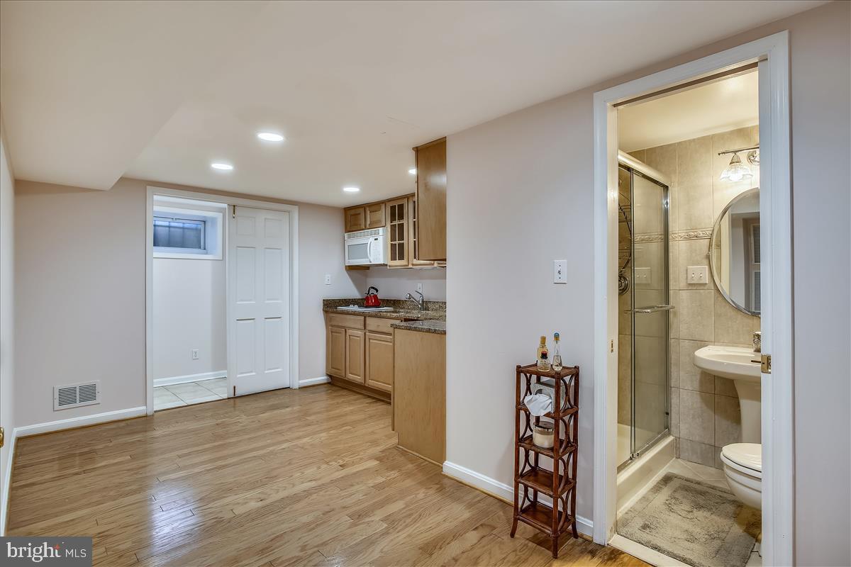 4664 Reservoir Road Northwest Washington, DC 20007 - Photo 46 of 60 a view of empty room and wooden floor