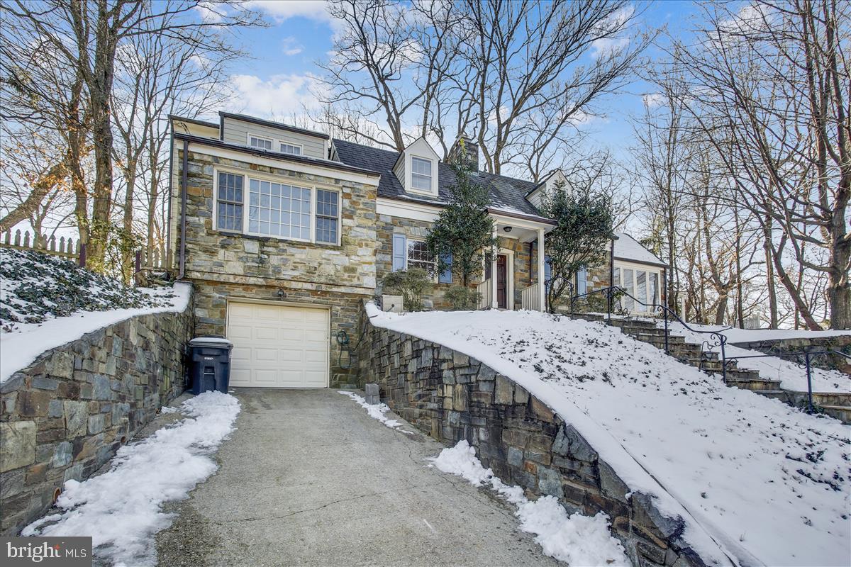 4664 Reservoir Road Northwest Washington, DC 20007 - Photo 52 of 60 a view of a house with a yard covered in snow