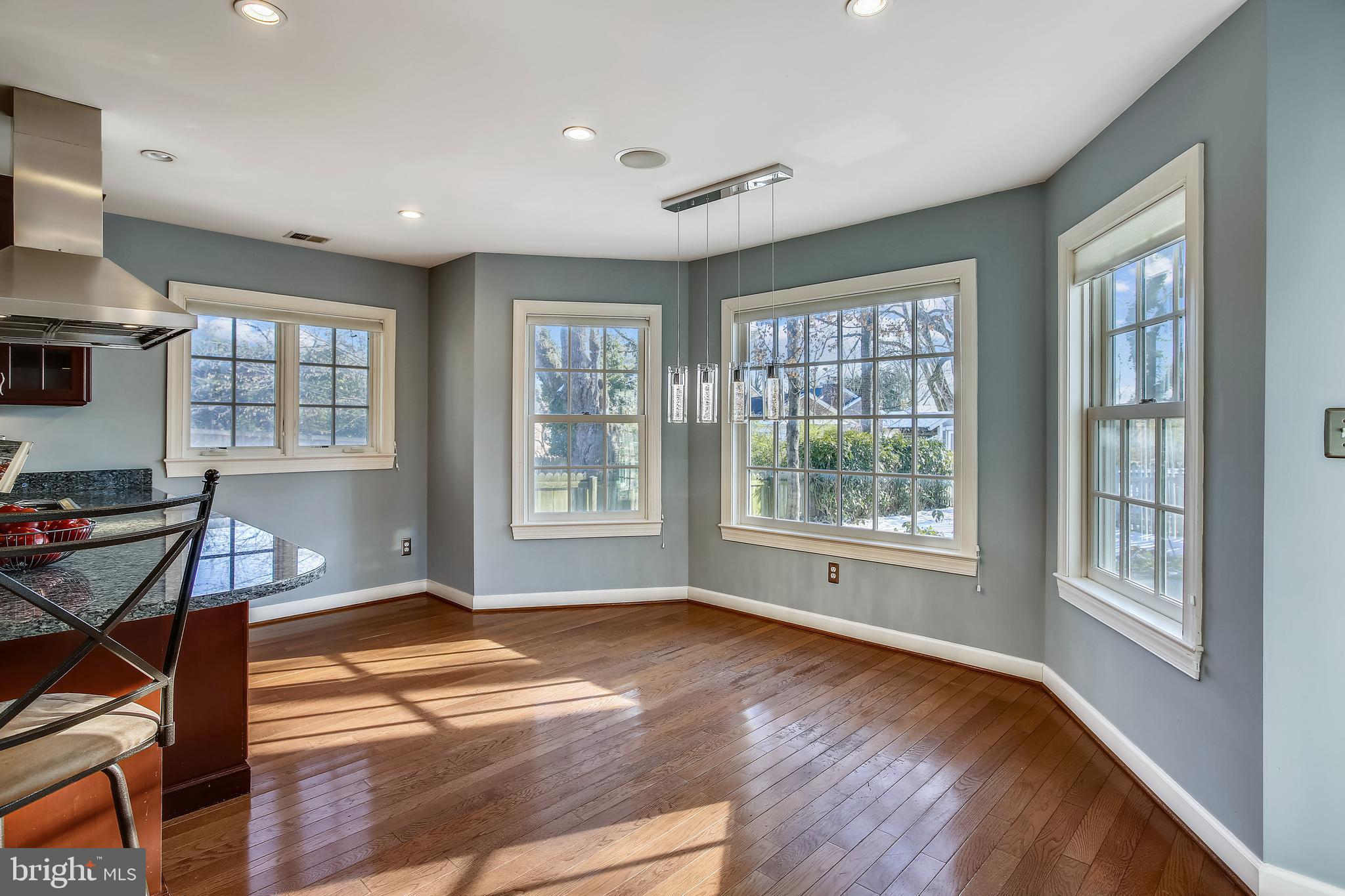 4664 Reservoir Road Northwest Washington, DC 20007 - Photo 7 of 60 a view of an empty room with a window and wooden floor