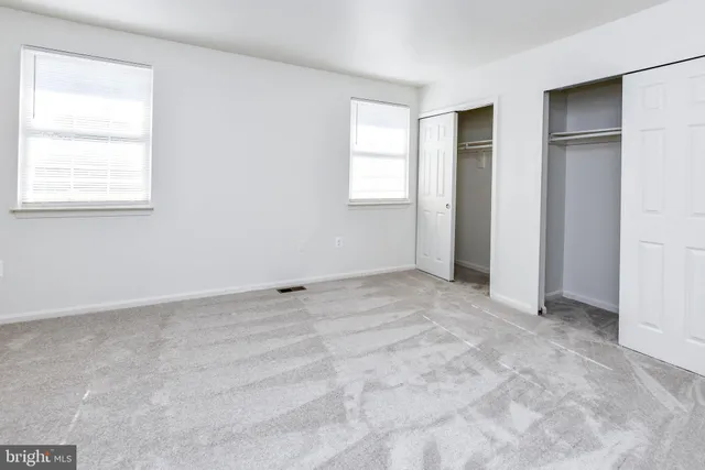 an empty room with windows