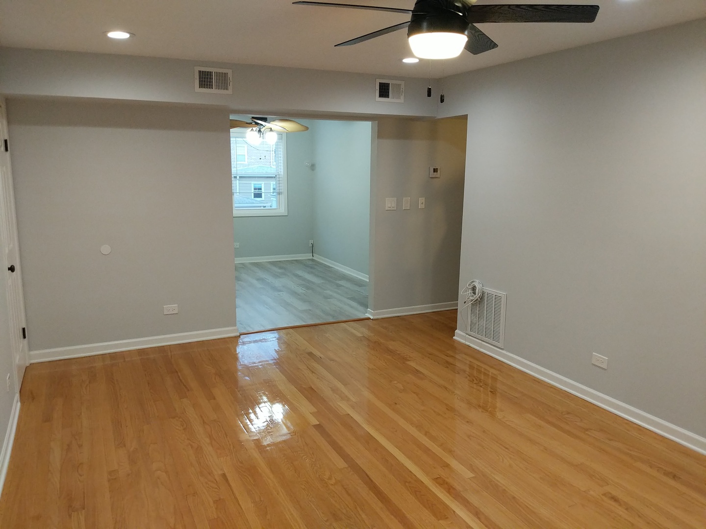 2652 West Rascher Avenue, Unit 203 Chicago, IL 60625 - Photo 11 of 17 wooden floor in an empty room with a window