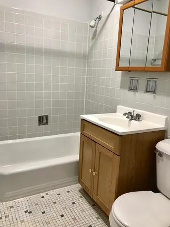 a bathroom with a sink a toilet and bathtub