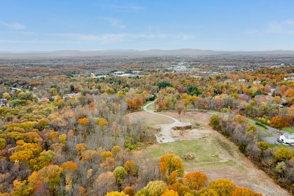 a view of a yard with an ocean view