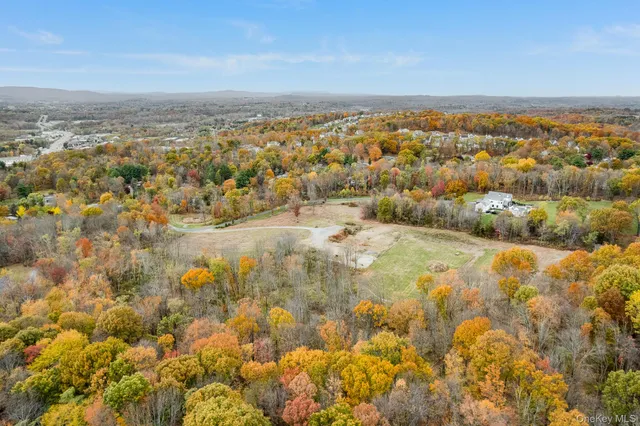 a view of a yard with an ocean view