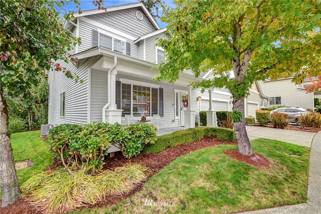 2405 194th Street Southeast Bothell, WA 98012 - Photo 2 of 28 a front view of a house with a yard and fountain