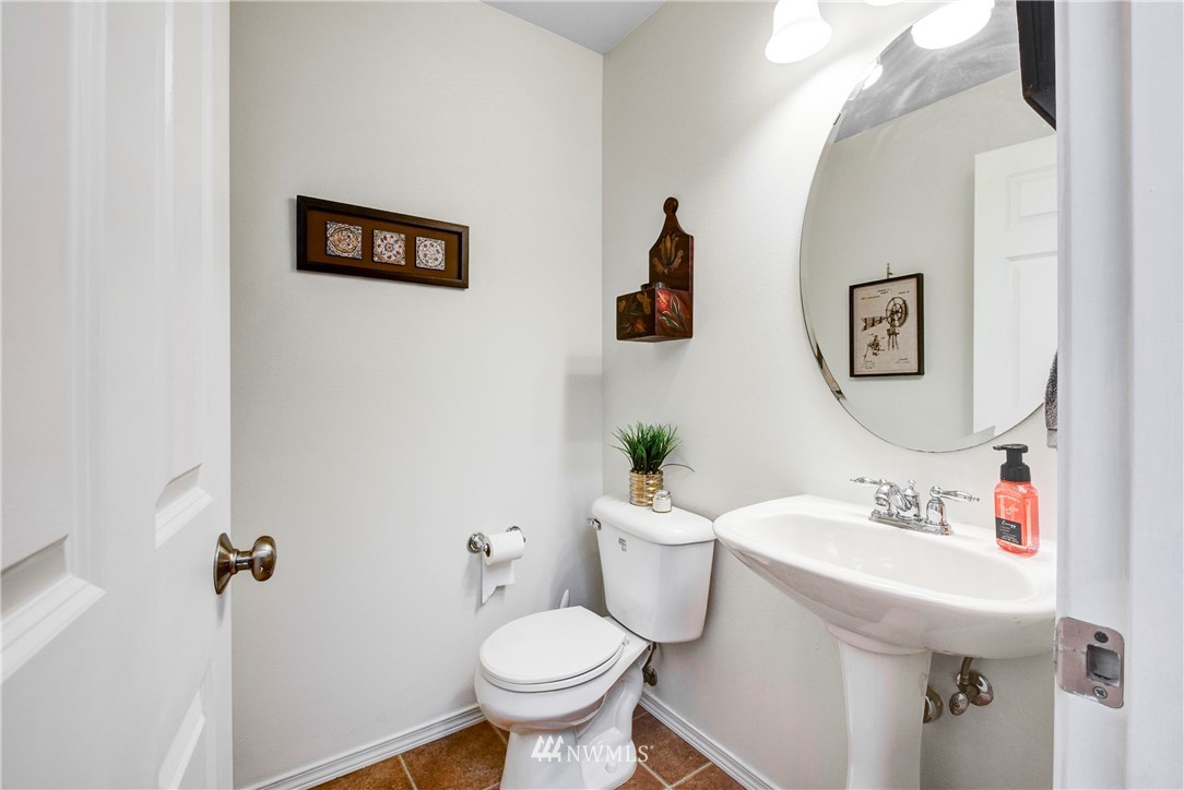 2405 194th Street Southeast Bothell, WA 98012 - Photo 13 of 28 a bathroom with a sink toilet and a mirror