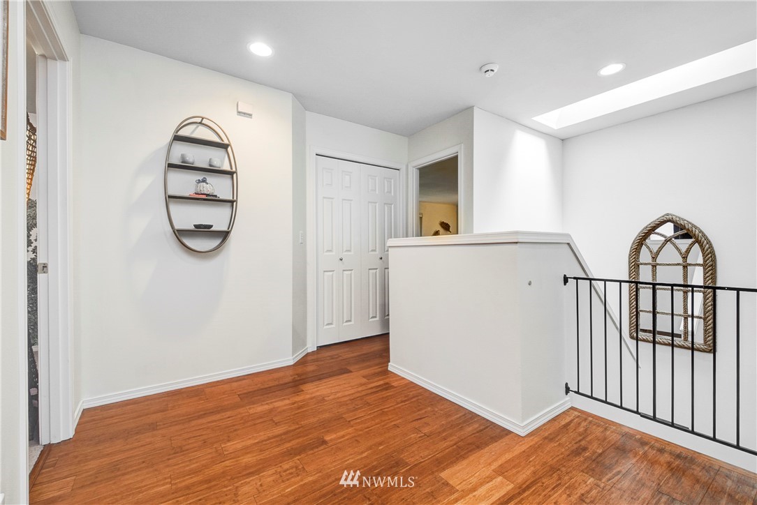 2405 194th Street Southeast Bothell, WA 98012 - Photo 18 of 28 a view of a room with wooden floor and white walls