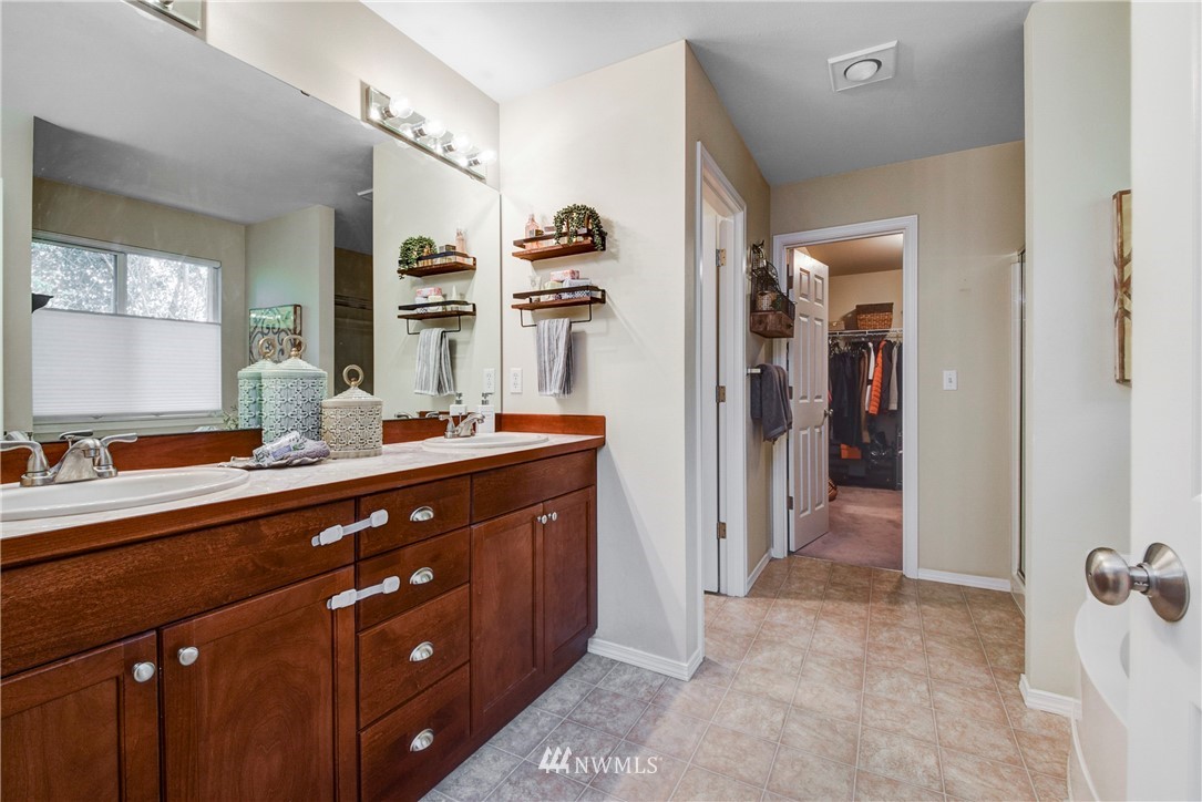 2405 194th Street Southeast Bothell, WA 98012 - Photo 21 of 28 a spacious bathroom with a double vanity sink a and mirror