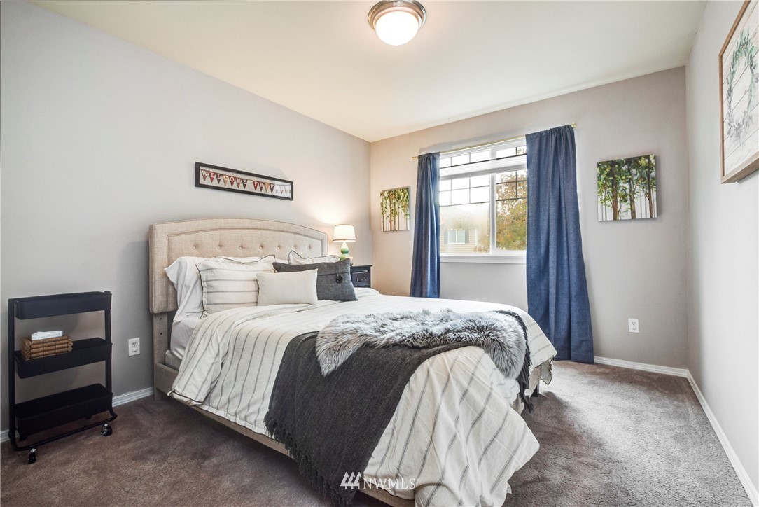 2405 194th Street Southeast Bothell, WA 98012 - Photo 23 of 28 a bedroom with a bed and a window