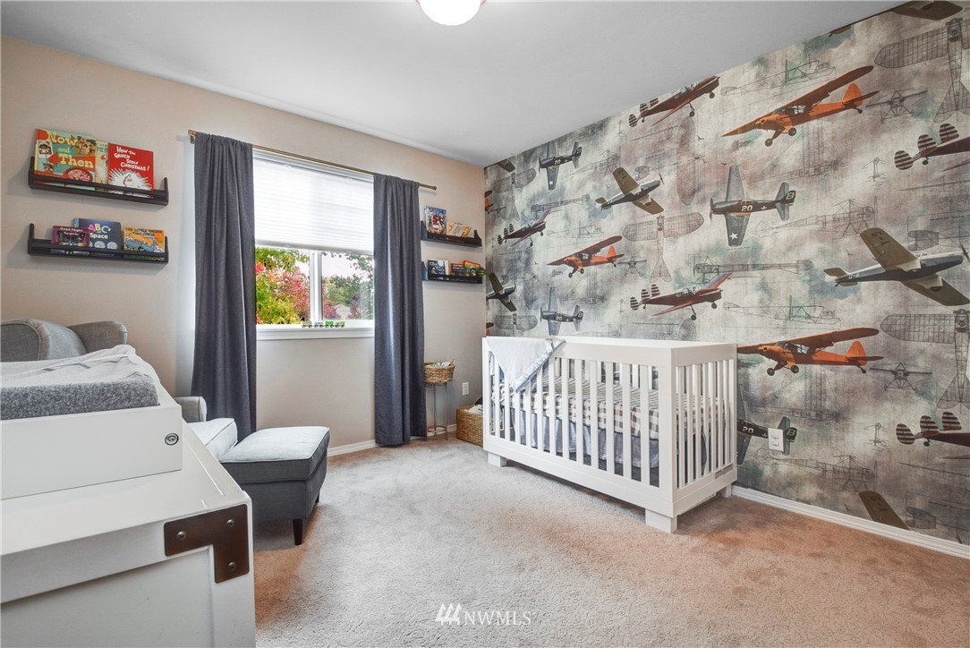 2405 194th Street Southeast Bothell, WA 98012 - Photo 24 of 28 a bedroom with a bed and a window