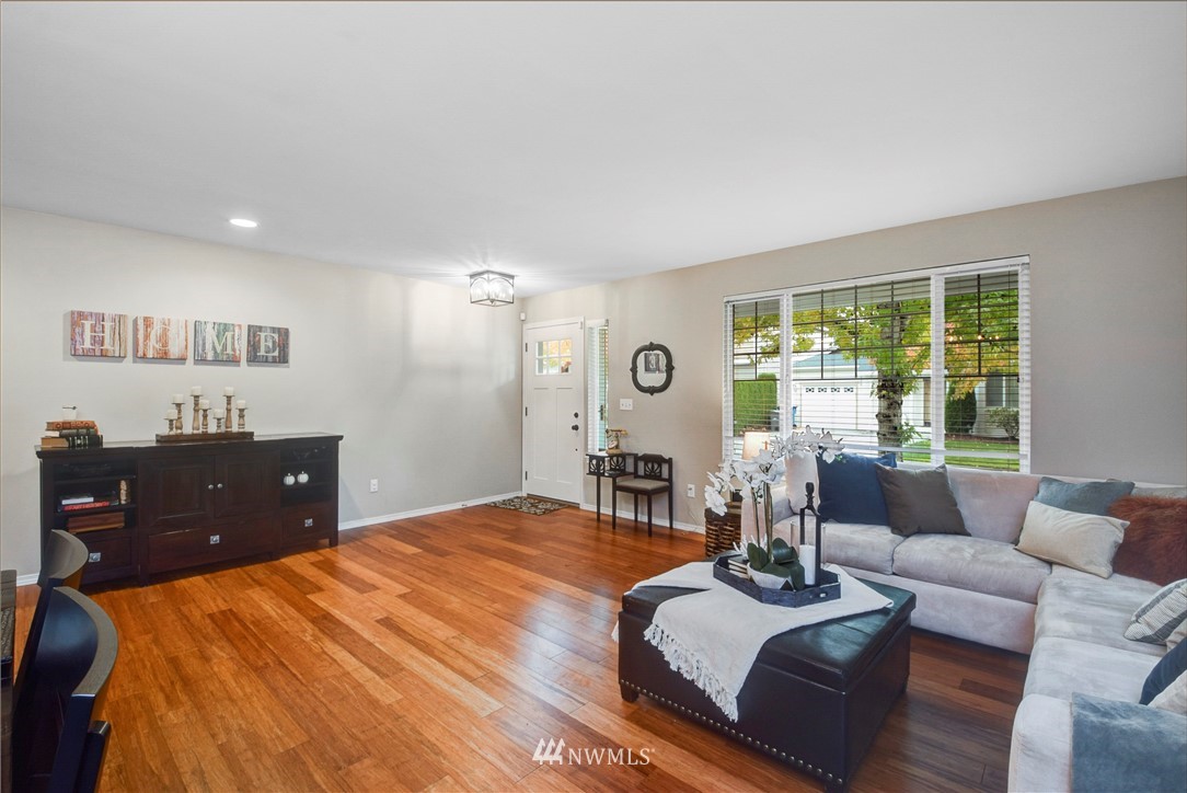 2405 194th Street Southeast Bothell, WA 98012 - Photo 5 of 28 a bedroom with a bed and wooden floor