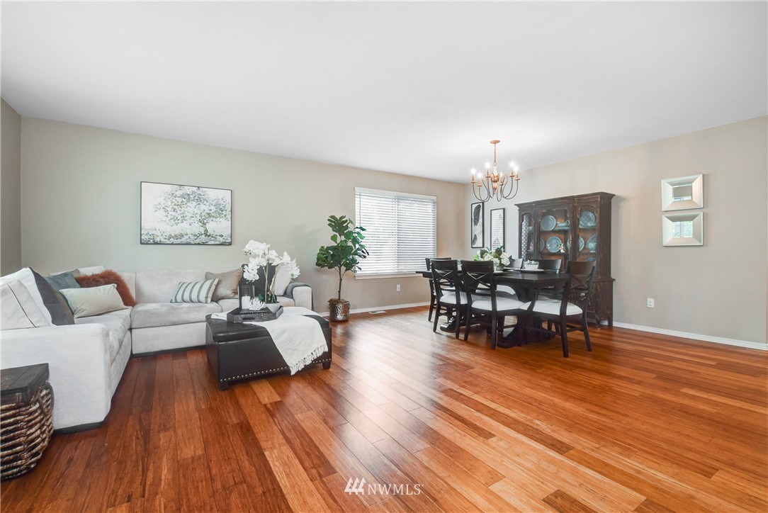 2405 194th Street Southeast Bothell, WA 98012 - Photo 7 of 28 a living room with furniture and a wooden floor