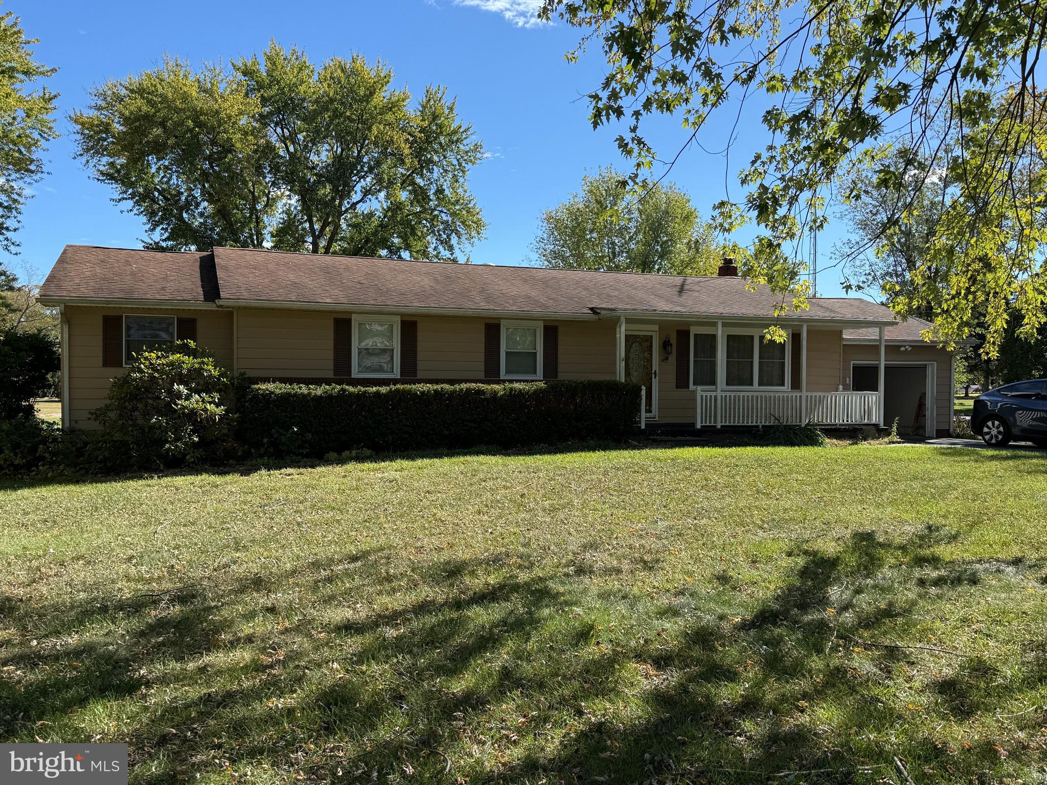405 Parvin Mill Road Bridgeton, NJ 08302 - Photo 1 of 28 a front view of a house with a garden
