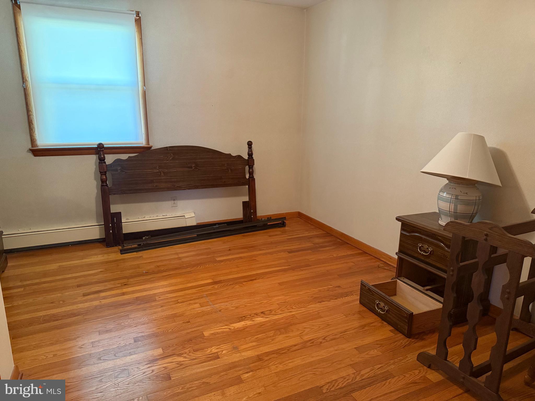 405 Parvin Mill Road Bridgeton, NJ 08302 - Photo 13 of 28 a room with wooden floor and furniture