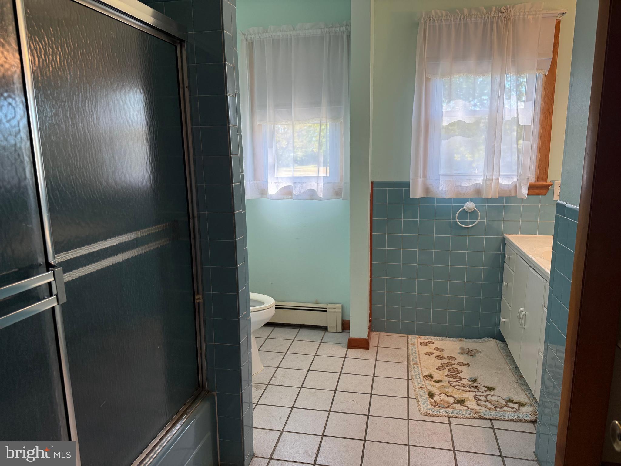 405 Parvin Mill Road Bridgeton, NJ 08302 - Photo 17 of 28 a bathroom with a glass door shower