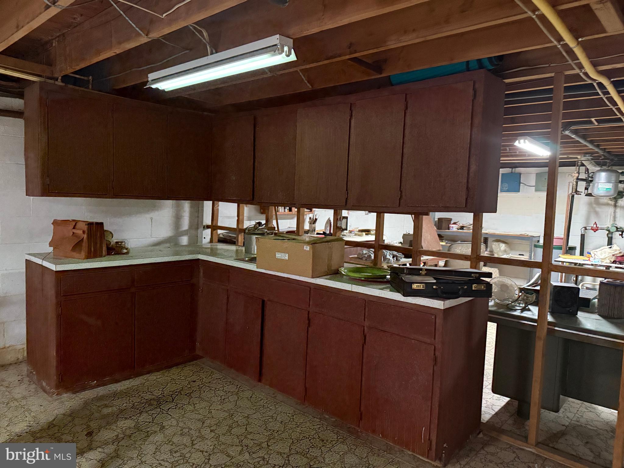 405 Parvin Mill Road Bridgeton, NJ 08302 - Photo 24 of 28 a kitchen with a sink and cabinets
