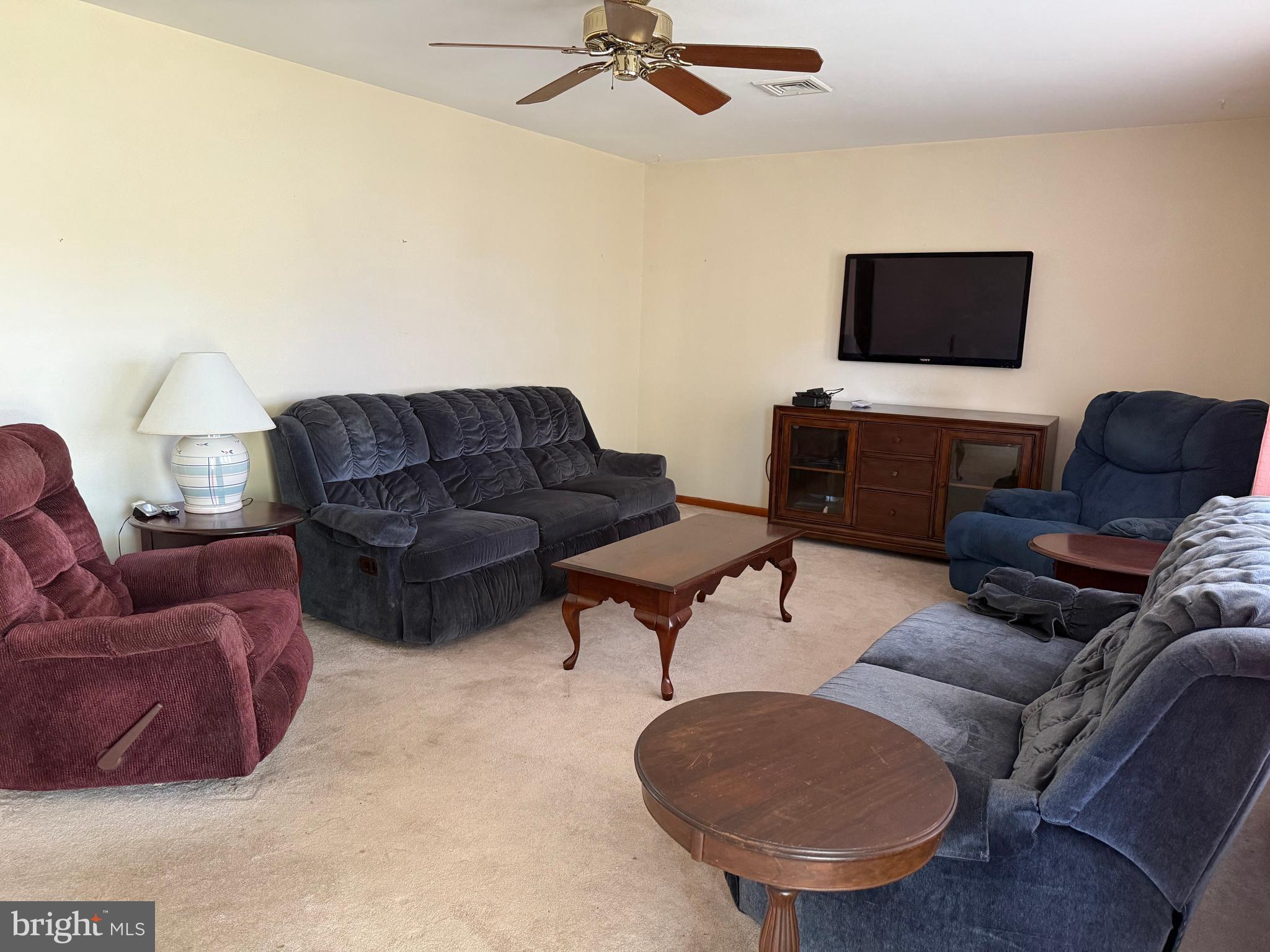 405 Parvin Mill Road Bridgeton, NJ 08302 - Photo 9 of 28 a living room with furniture and a flat screen tv