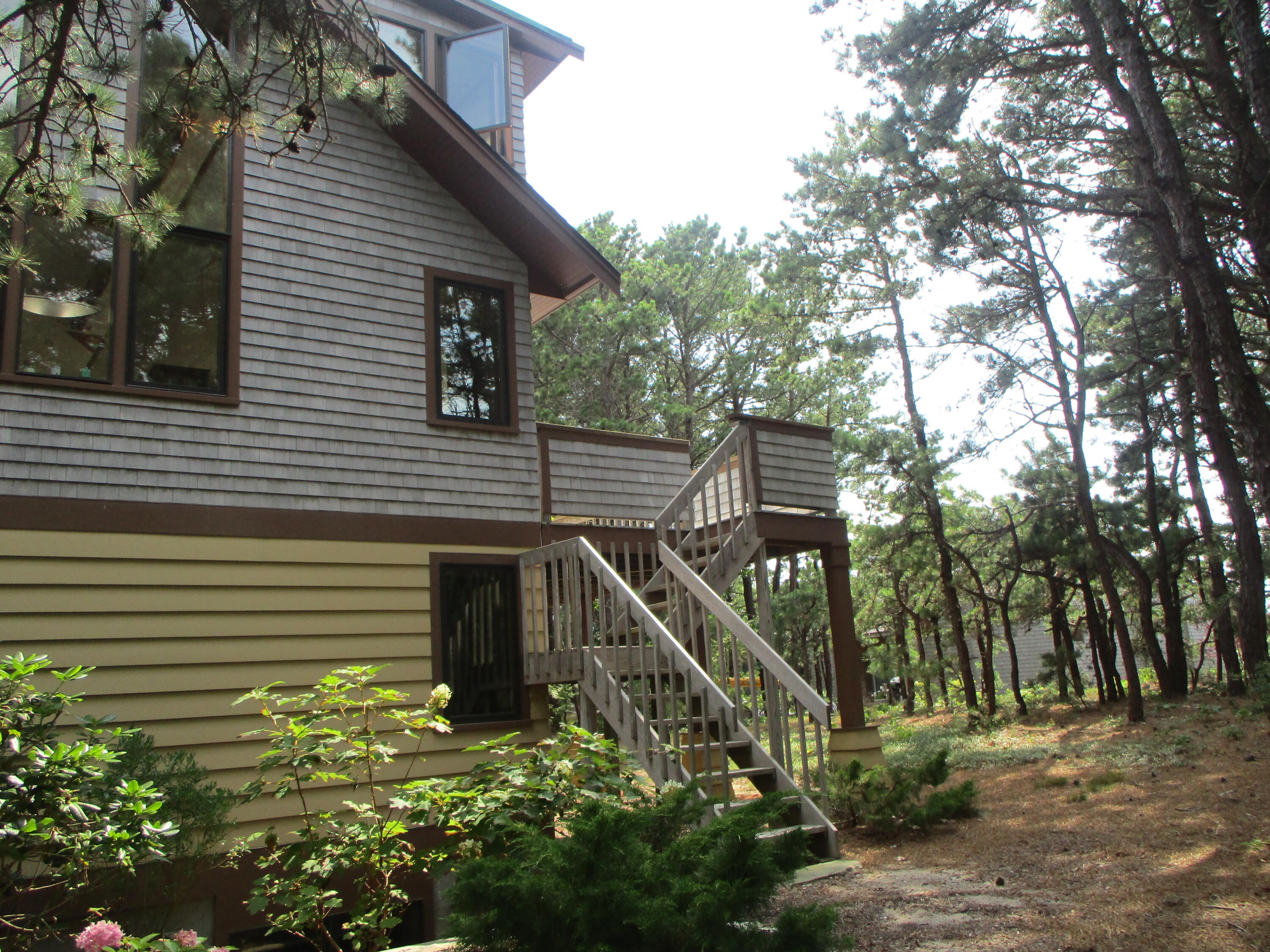 55 Lookout Road Wellfleet, MA 02667 - Photo 13 of 13 a view of a house with a small yard