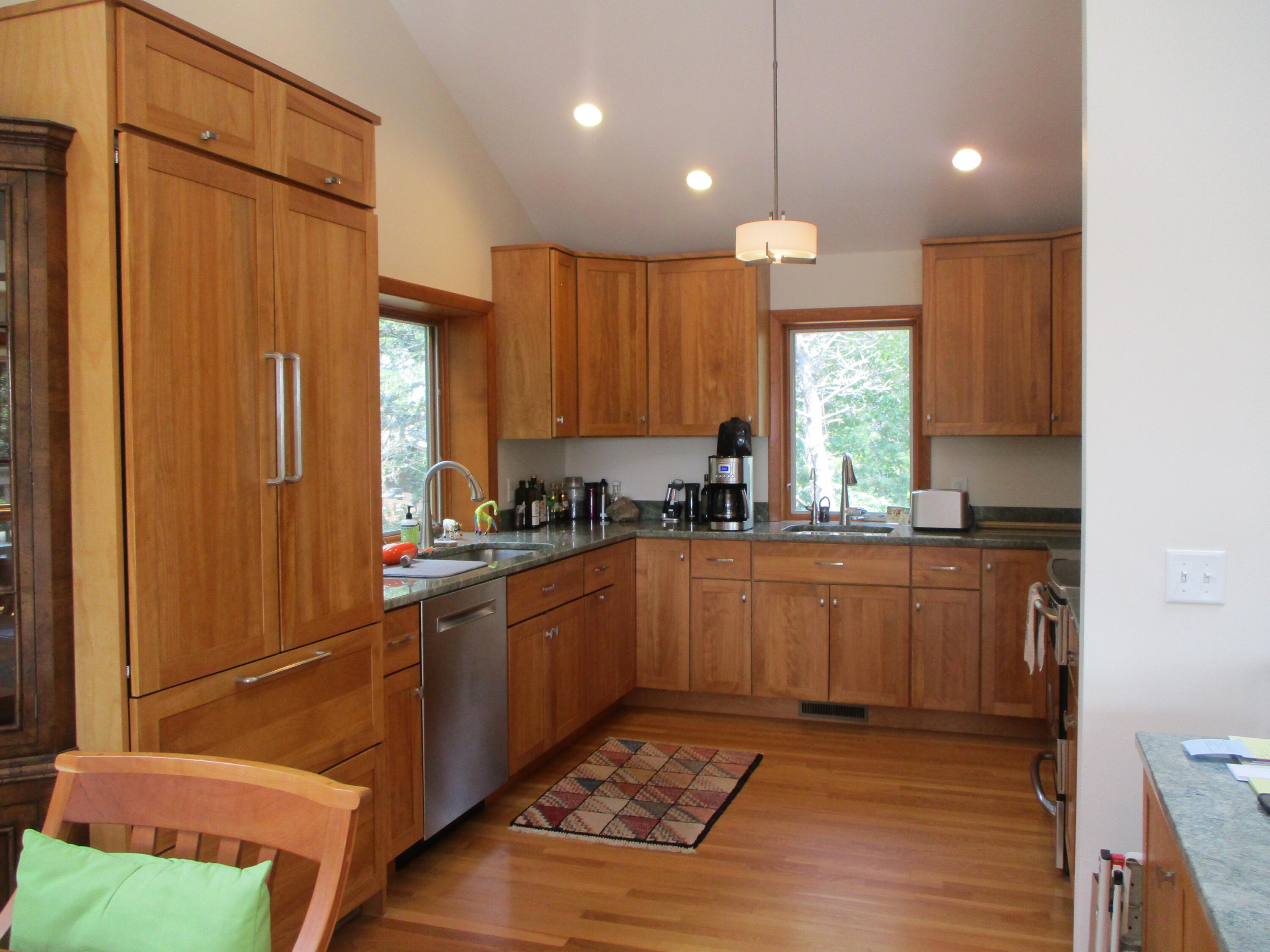 55 Lookout Road Wellfleet, MA 02667 - Photo 7 of 13 a kitchen with kitchen island granite countertop wooden cabinets a sink and a window