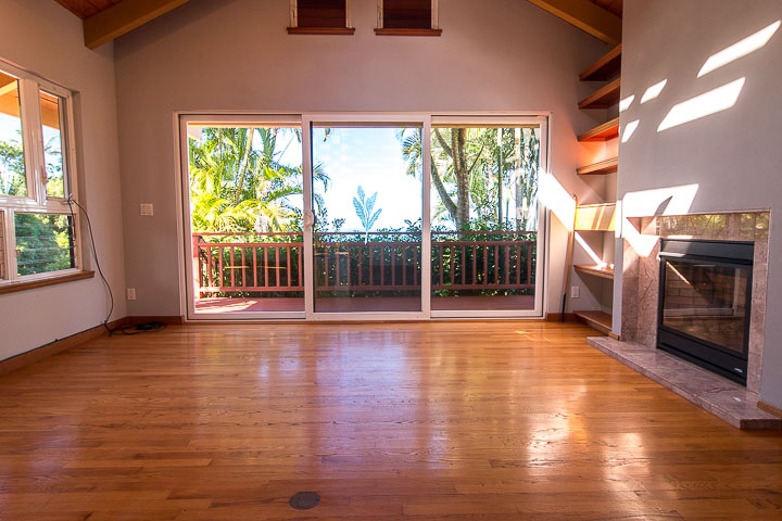 47 Door Of Faith Road Haiku, HI 96708 - Photo 15 of 30 a view of empty room with wooden floor and fireplace
