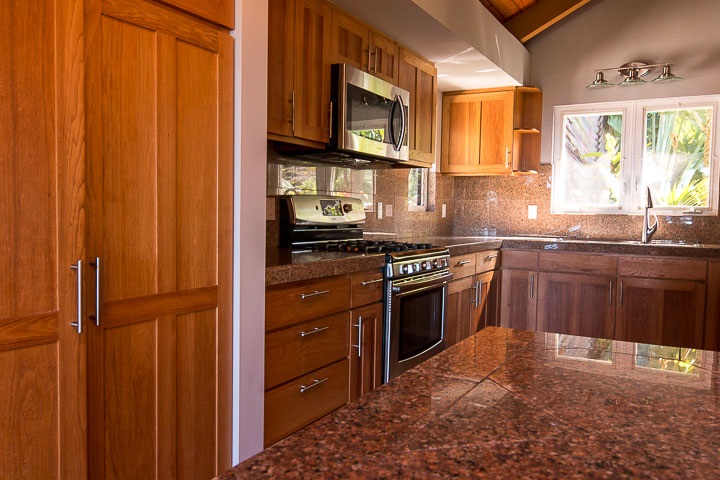 47 Door Of Faith Road Haiku, HI 96708 - Photo 17 of 30 a kitchen with stainless steel appliances granite countertop a stove a sink and a microwave