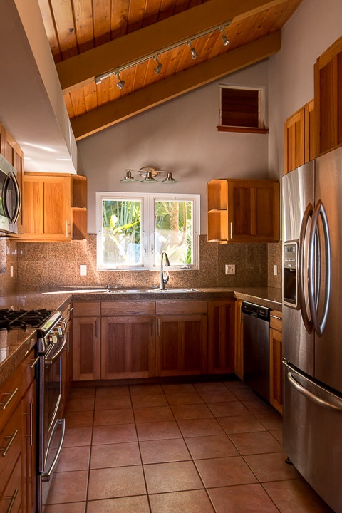 47 Door Of Faith Road Haiku, HI 96708 - Photo 18 of 30 a kitchen with stainless steel appliances granite countertop a stove sink and cabinets