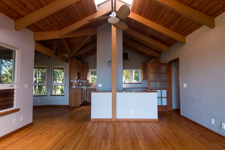 47 Door Of Faith Road Haiku, HI 96708 - Photo 19 of 30 a kitchen with a wooden floor and a window