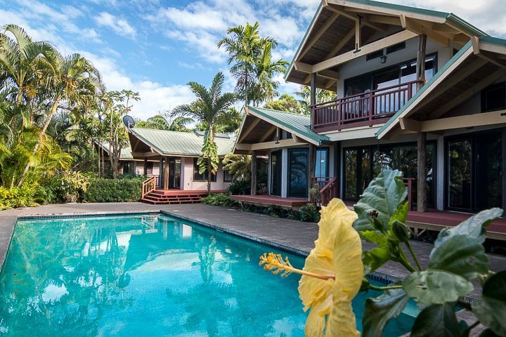 47 Door Of Faith Road Haiku, HI 96708 - Photo 2 of 30 a front view of a house with swimming pool having outdoor seating