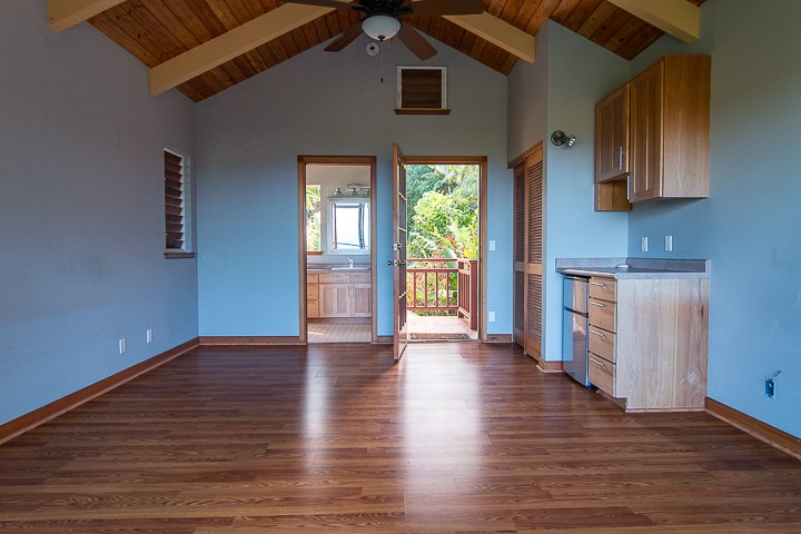 47 Door Of Faith Road Haiku, HI 96708 - Photo 21 of 30 a view of an empty room with window and wooden floor