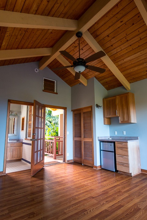 47 Door Of Faith Road Haiku, HI 96708 - Photo 22 of 30 a view of a livingroom with wooden floor