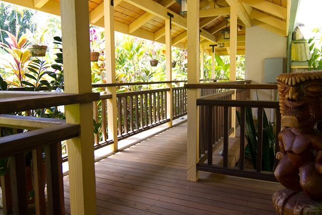 47 Door Of Faith Road Haiku, HI 96708 - Photo 10 of 30 a view of a balcony with wooden floor and outdoor seating