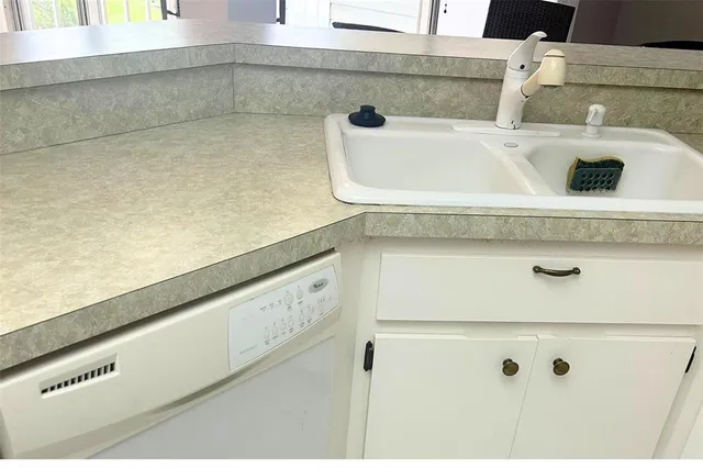 a view of a dining room with furniture and window