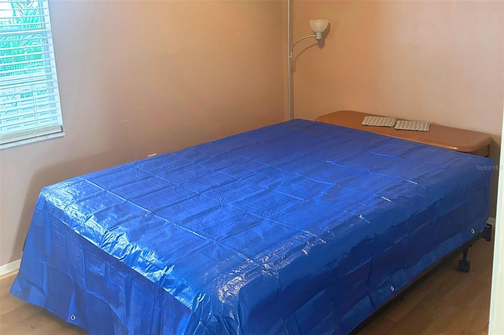 6932 Stonesthrow Circle North, Unit 7204 St. Petersburg, FL 33710 - Photo 8 of 27 a view of a room with closet and wooden floor