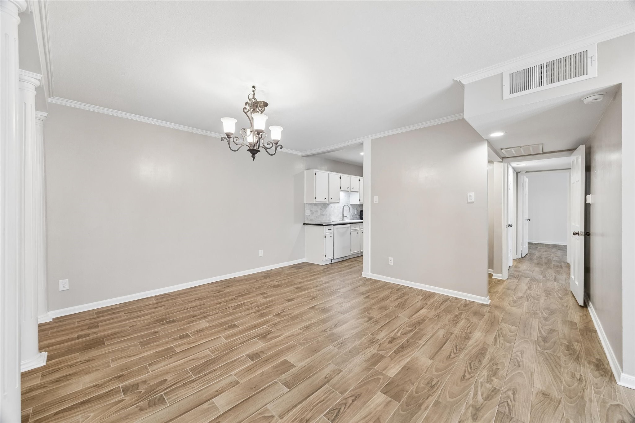 2230 South Piney Point Road, Unit 103 Houston, TX 77063 - Photo 3 of 28 All floors have been updated to wood-like tile! This is the dining looking into kitchen and hallway.