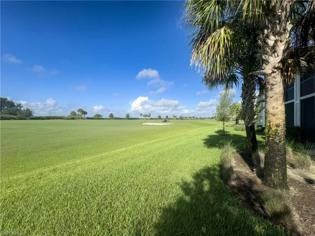 a front view of house and yard with green space