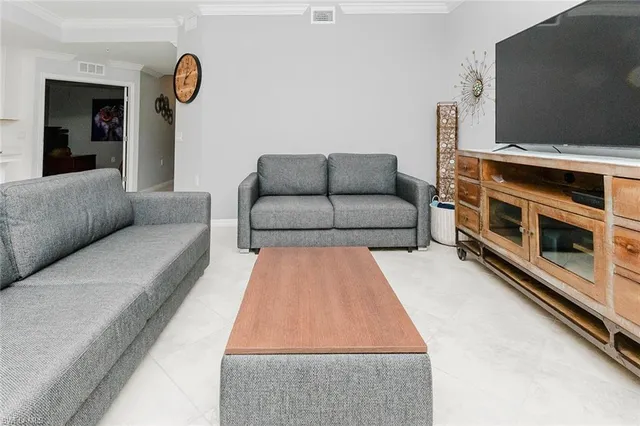 a bedroom with a bed dresser and a window