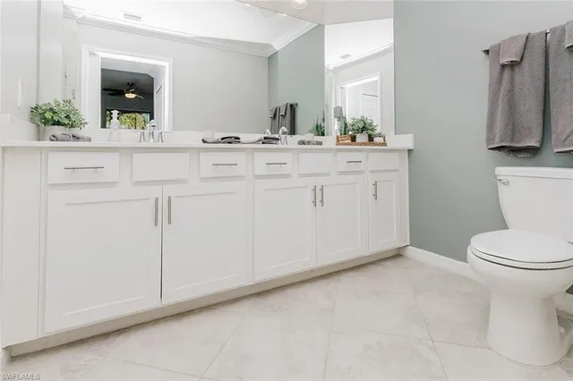 a hallway with furniture and wooden floor