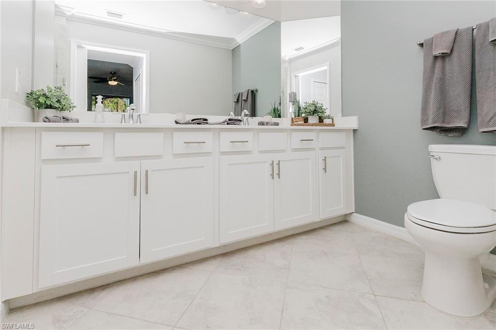 6082 National Blvd Avenue, Unit 115 Immokalee, FL 34142 - Photo 18 of 50 a bathroom with a sink and a toilet