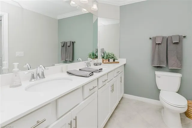 a room with furniture and wall paintings