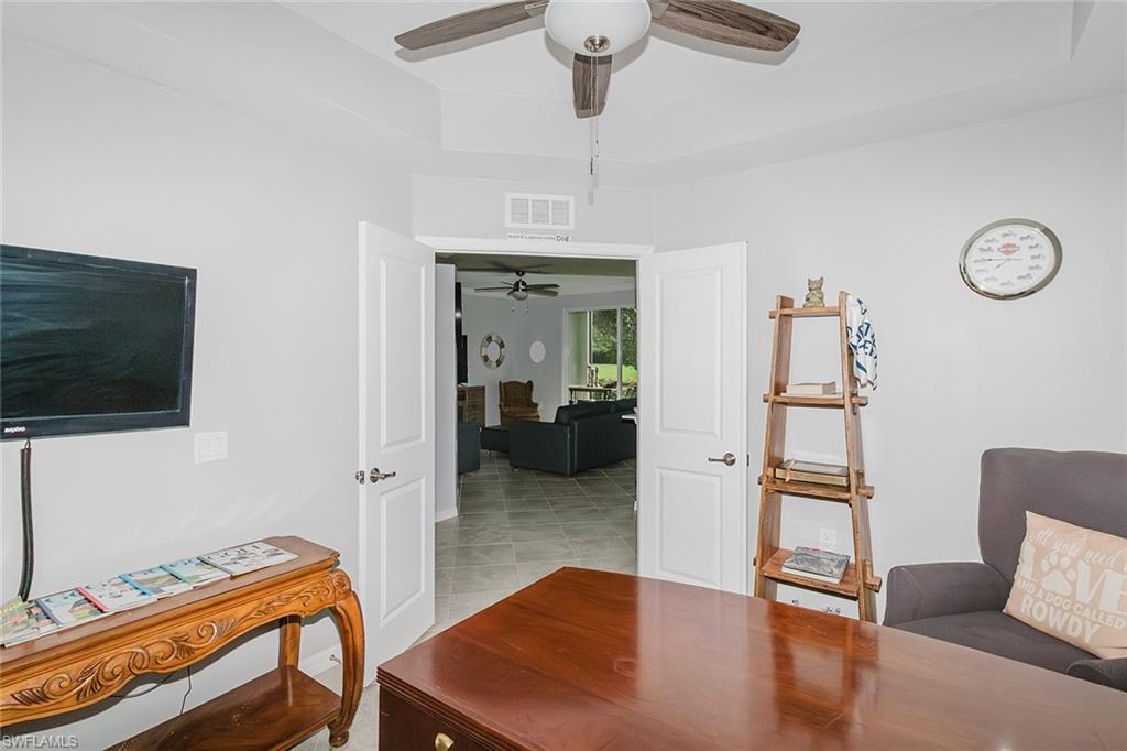 6082 National Blvd Avenue, Unit 115 Immokalee, FL 34142 - Photo 24 of 50 a hallway with furniture and wooden floor
