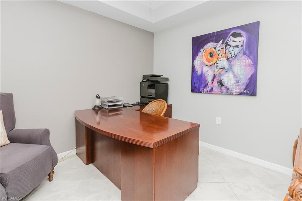 6082 National Blvd Avenue, Unit 115 Immokalee, FL 34142 - Photo 25 of 50 a room with furniture and wall paintings