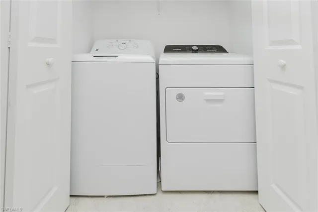 a room with stainless steel appliances kitchen island granite countertop furniture and a view of kitchen