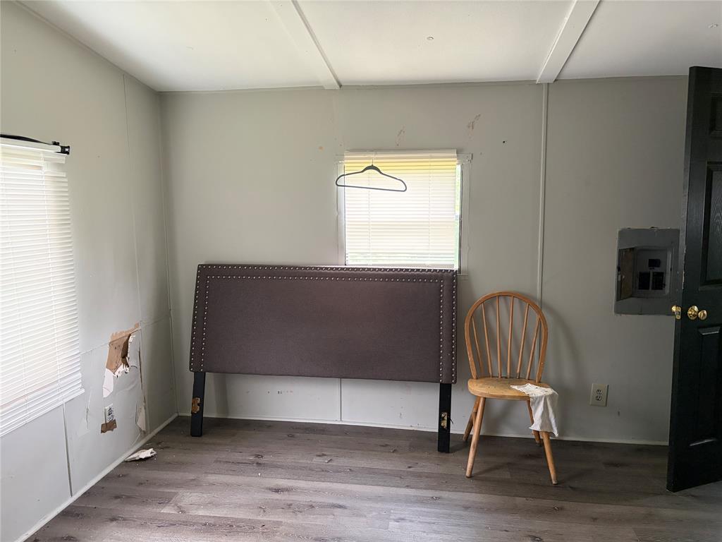 410 Patrick Street Minden, LA 71055 - Photo 7 of 9 Gray wood-finish flooring complements light-toned wall panels