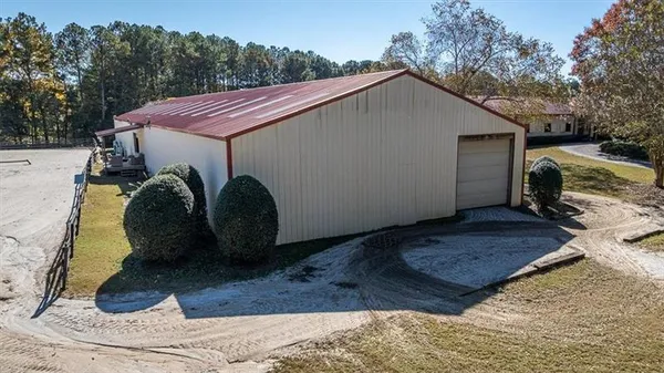 a view of a house with a yard and garage
