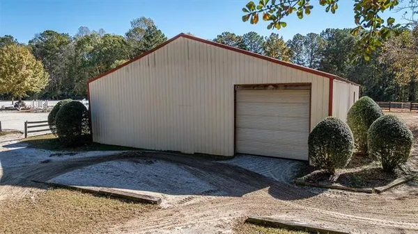 a view of a house with a yard and garage
