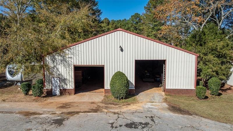 3055 A Spring Hill Drive Monroe, GA 30656 - Photo 32 of 65 a view of a house with a yard and garage