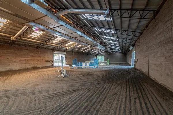 a view of a house with backyard and a tree